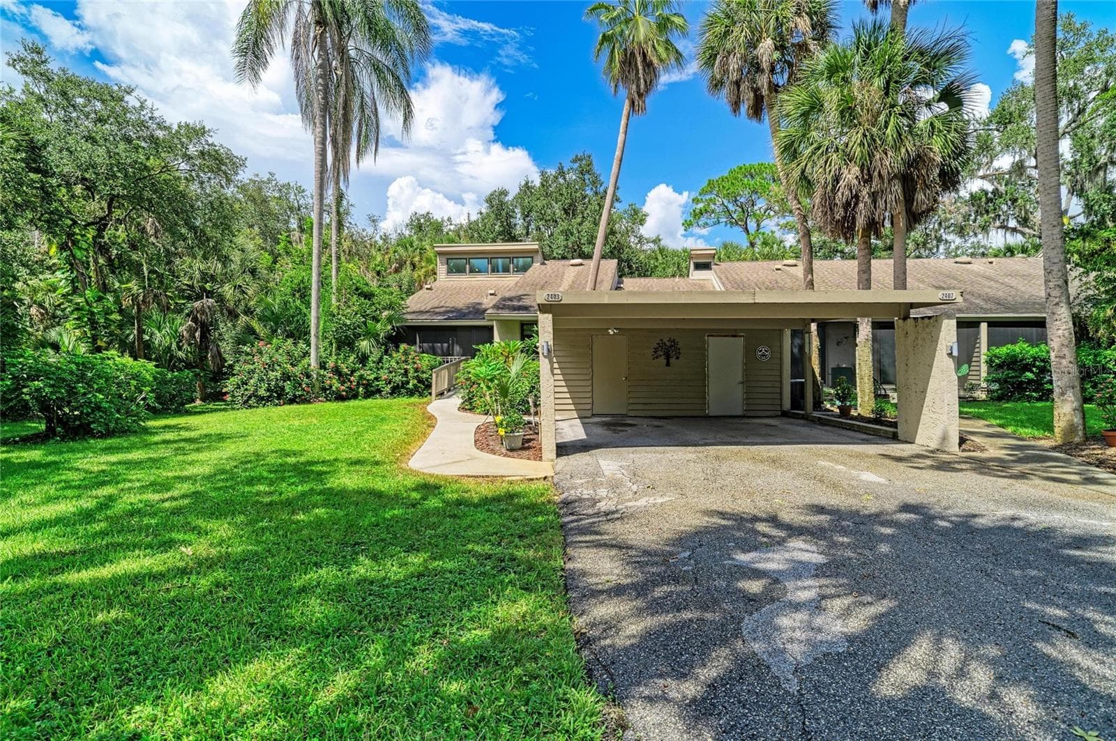 Carport with storage inside - 2403 ARBORETUM CIR #29, SARASOTA