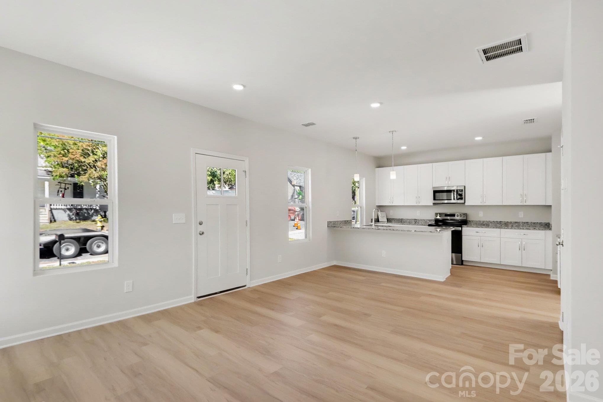 Actual non-staged photo of great room inside 125 Buffalo Avenue NW. - 125 Buffalo Avenue NW, Concord