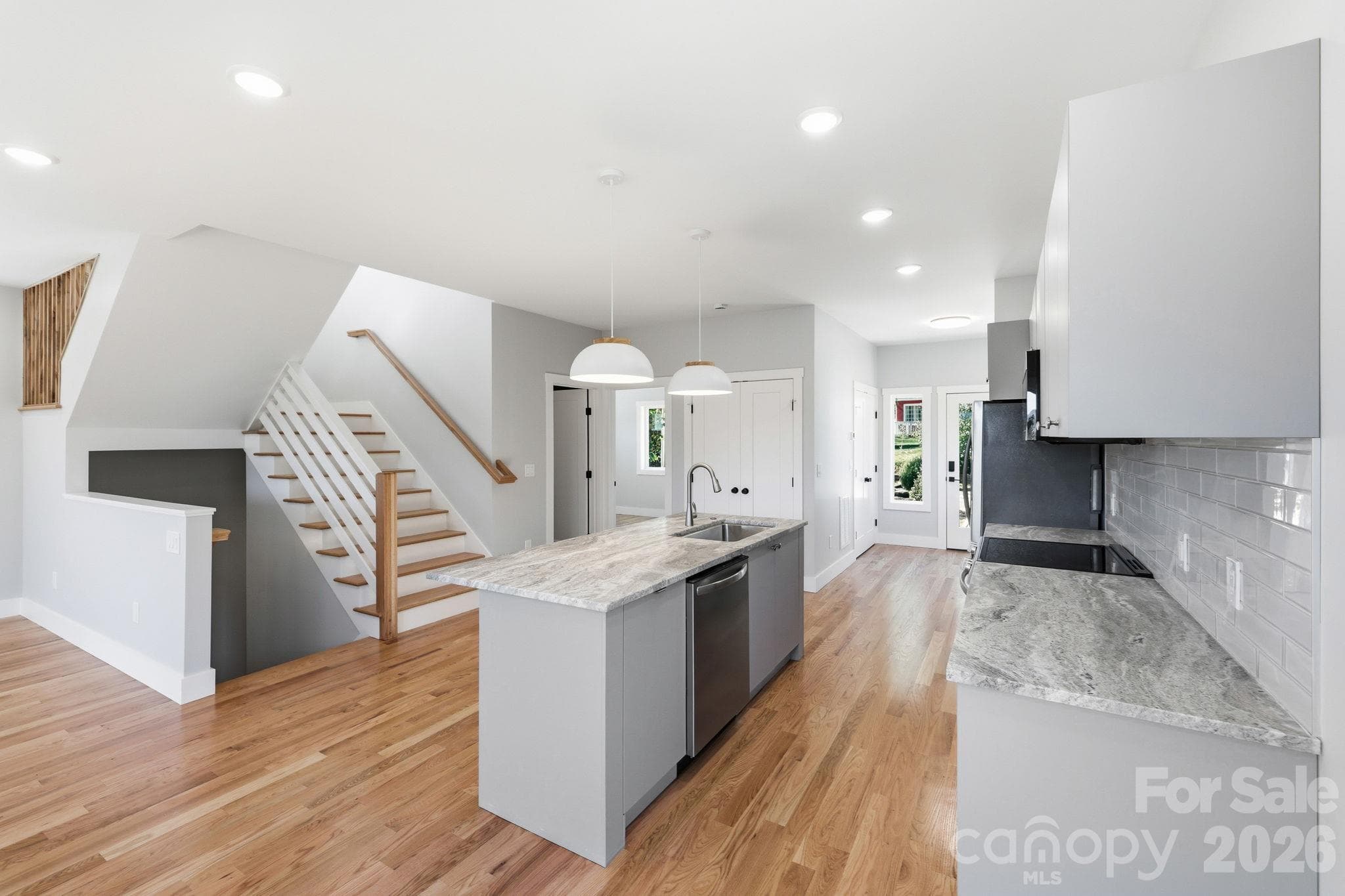 Open concept kitchen with stylish kitchen island and counters - 20 Laurel Loop, Asheville