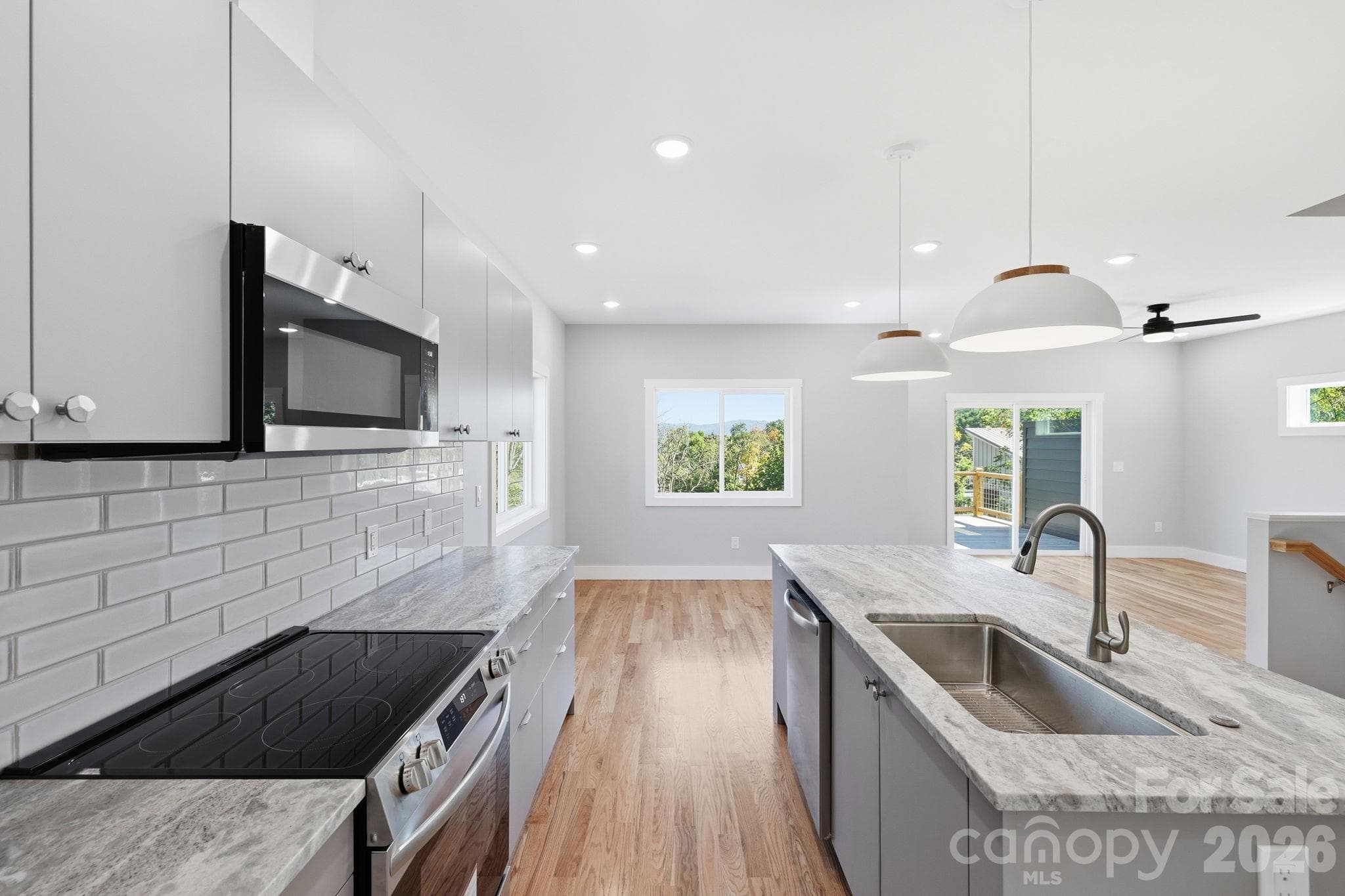 Beautiful and bright open concept kitchen, dining, and living area - 20 Laurel Loop, Asheville