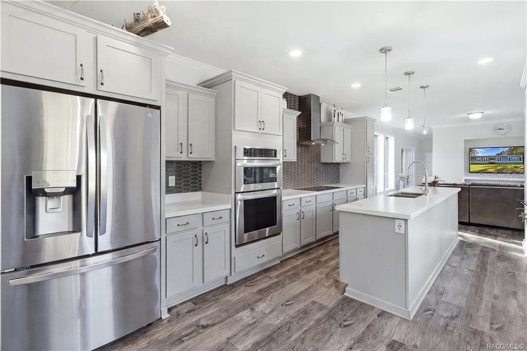STYLE MEETS FUNCTION! The thoughtfully designed kitchen features GRAY CABINETRY, a DOUBLE-BASIN SINK, sleek spring-style faucet & large windows overlooking the beautiful outdoors. - 7528 N CHABAUD TER, CRYSTAL RIVER