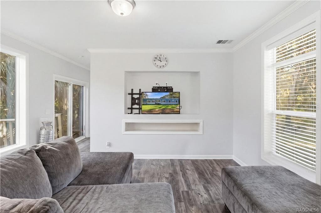 A COZY PLACE TO UNWIND! Enjoy the comfortable living area featuring large windows, neutral finishes & a recessed entertainment space. - 7528 N CHABAUD TER, CRYSTAL RIVER