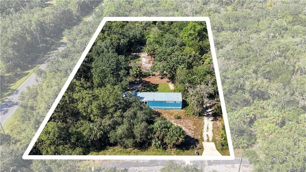 AERIAL PROPERTY VIEW: A beautiful look at the 1.42 FULLY FENCED ACRES w/GATED ENTRANCE, surrounded by mature trees, Florida palms & natural greenery. Room to enjoy the outdoors! - 7528 N CHABAUD TER, CRYSTAL RIVER