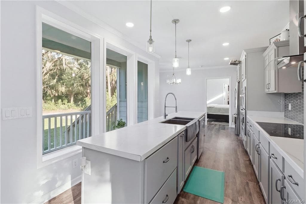 A KITCHEN W/A VIEW! The impressive island offers generous workspace, while large windows bring in natural light & showcase the surrounding greenery. - 7528 N CHABAUD TER, CRYSTAL RIVER