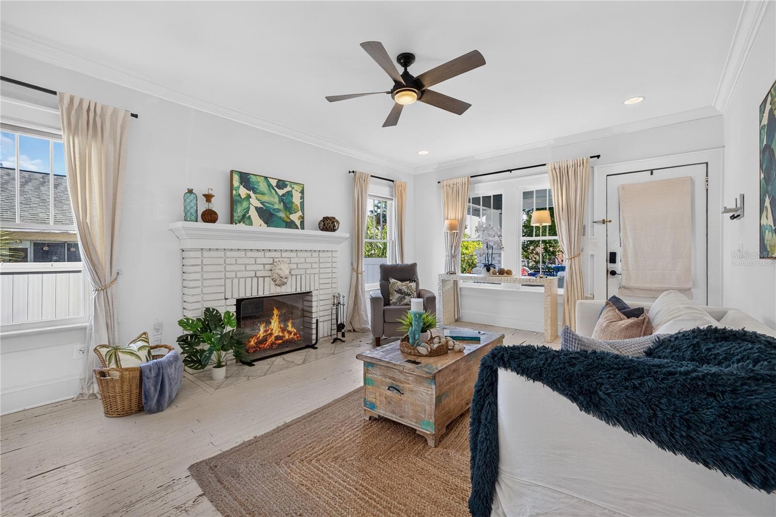 Living room (Fire in fireplace is virtually staged) - 2106 8TH AVE W, BRADENTON