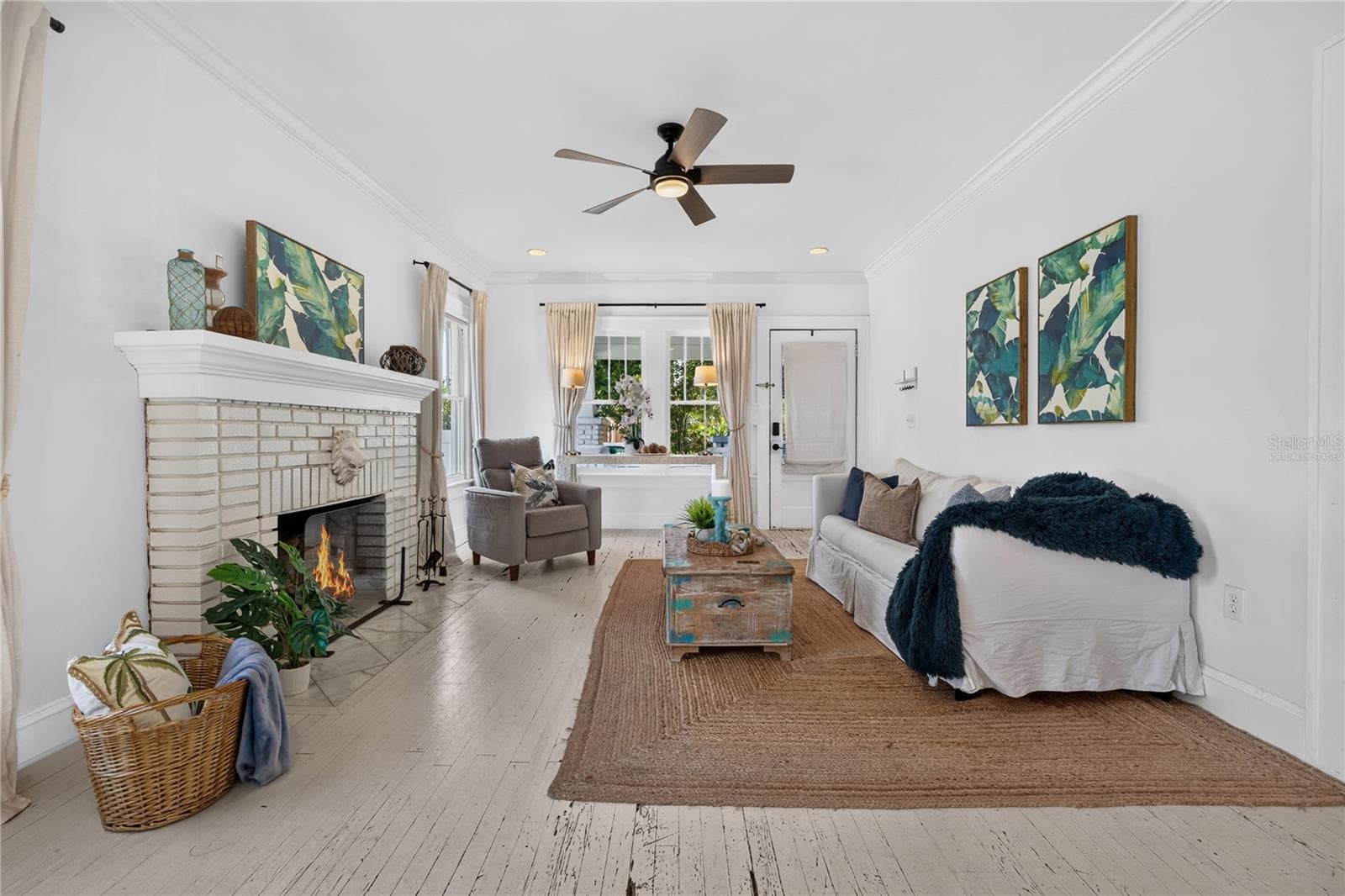 Living room (Fire in fireplace is virtually staged) - 2106 8TH AVE W, BRADENTON