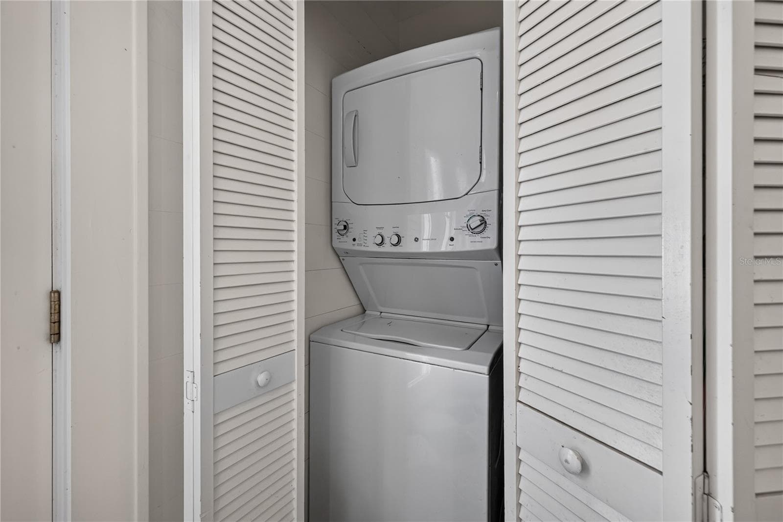 Stackable washer and dryer in laundry closet in the kitchen - 2106 8TH AVE W, BRADENTON