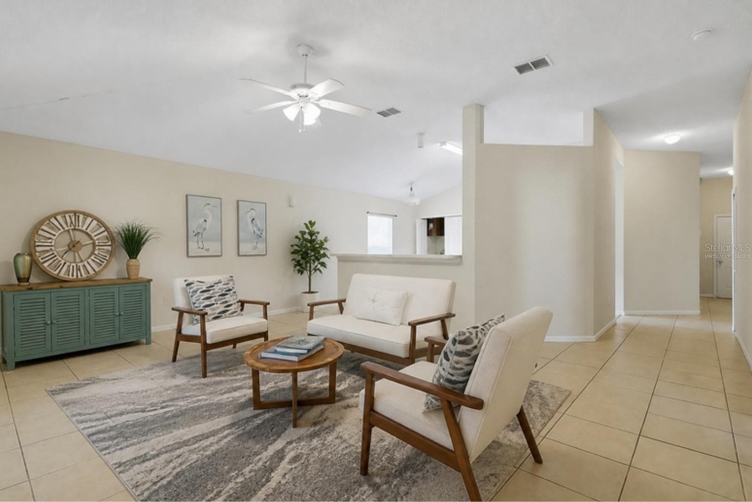 Virtually staged with the home's actual furniture - living area - 3 LOUVET LN, PALM COAST