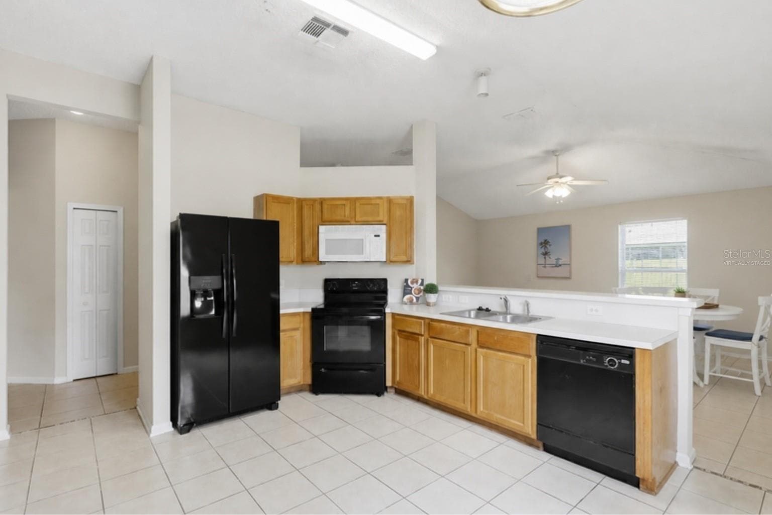 Virtually staged with the home's actual furniture - kitchen - 3 LOUVET LN, PALM COAST