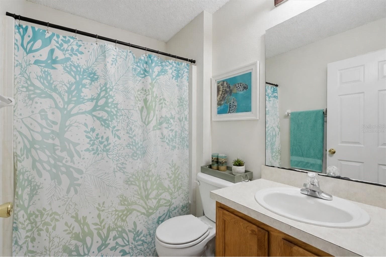 Virtually staged with the home's actual furniture - hall bath - 3 LOUVET LN, PALM COAST