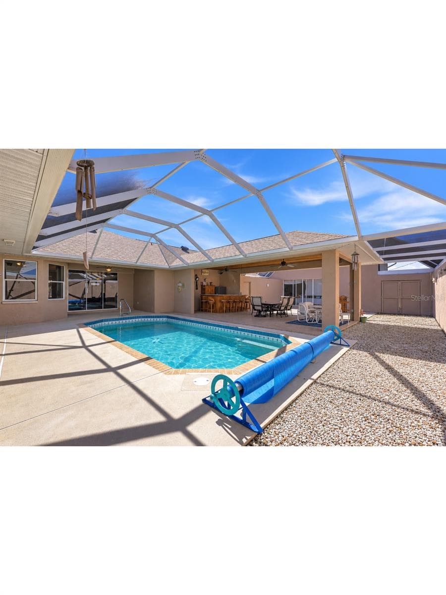 pool deck, bar and entertaining area with sliding doors to house and rv garage - 9348 SAN BERNANDINO AVE, ENGLEWOOD