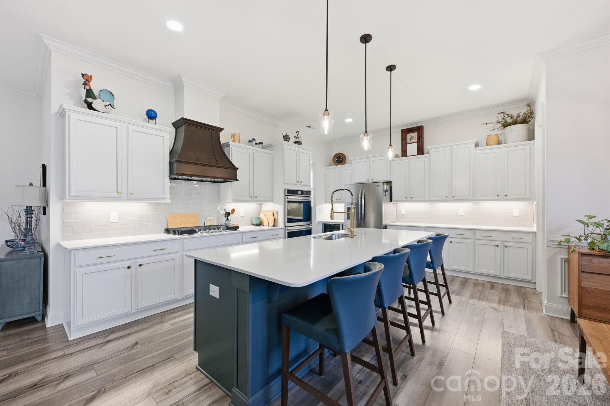 Welcome to the ease of entertaining featuring a custom vent hood and drawer microwave - 4025 Pollock View, Mount Holly