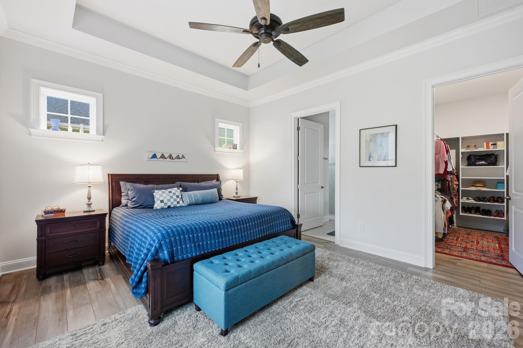 The king size primary features a custom walk-in closet. - 4025 Pollock View, Mount Holly