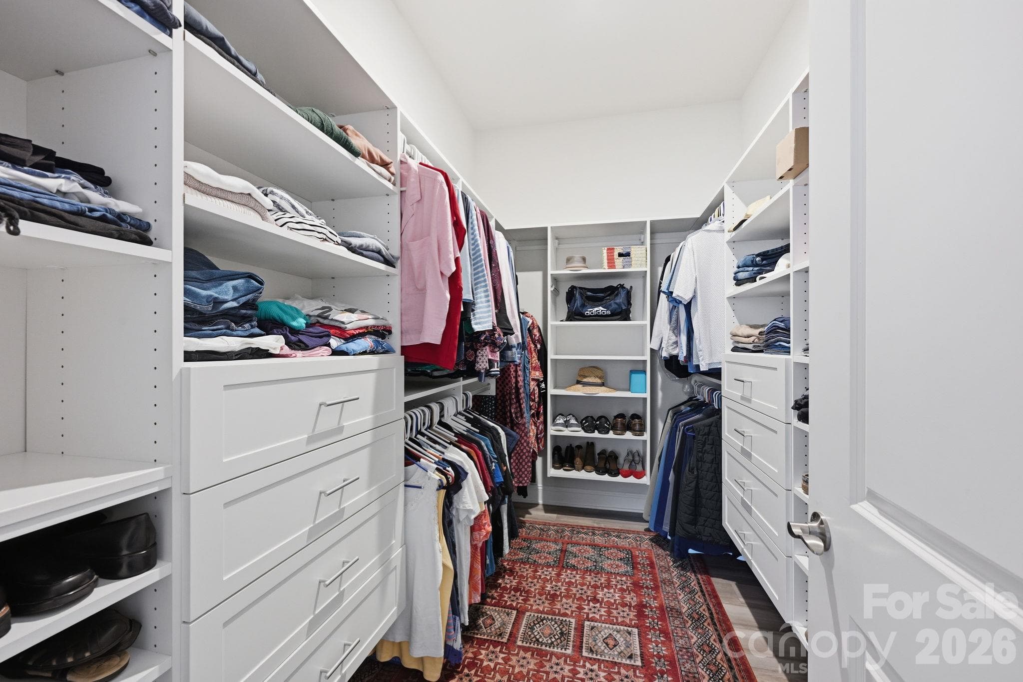 Custom walk-in closet in the primary suite. - 4025 Pollock View, Mount Holly