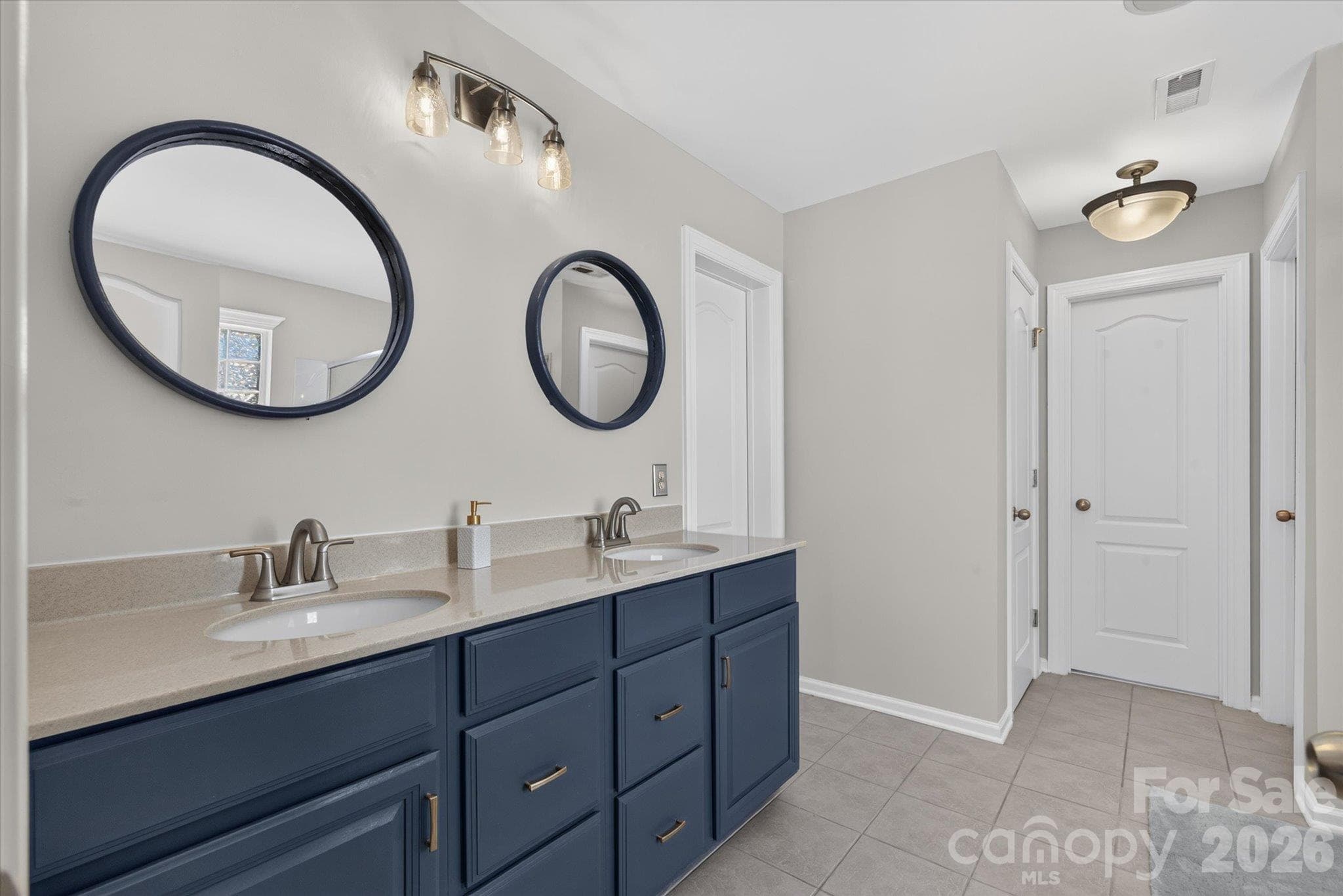 Primary bath with dual walk-in closets - 6107 Cactus Valley Road, Charlotte