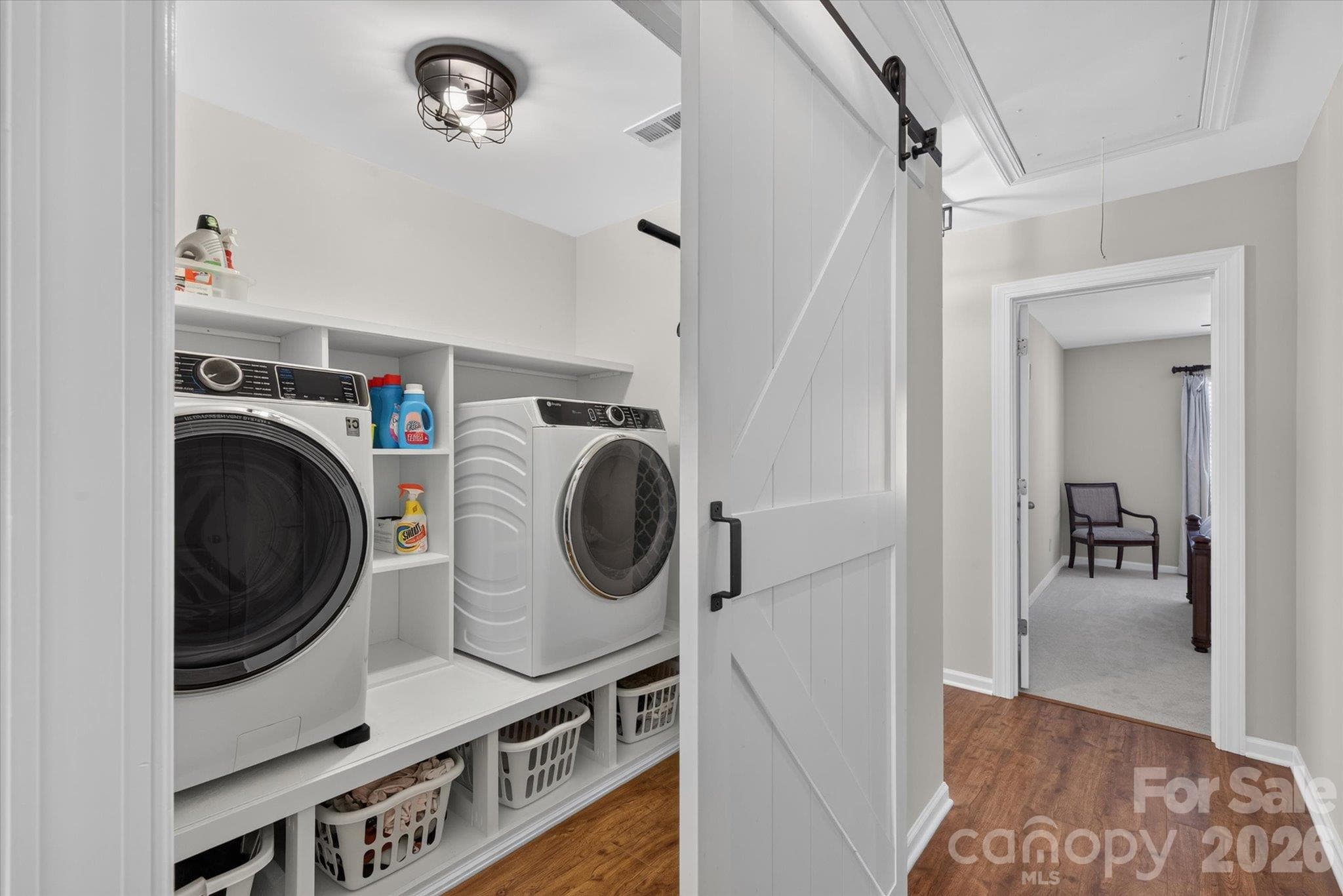 Laundry room with custom storage - 6107 Cactus Valley Road, Charlotte