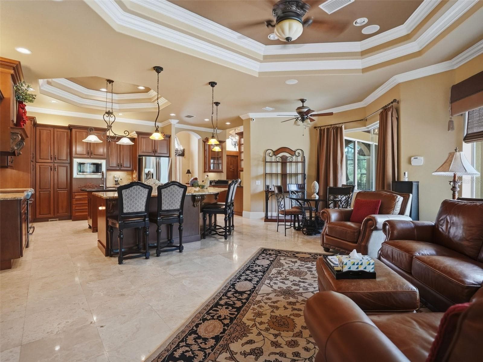 The kitchen is open to the large gathering family room - 9313 HERNANDO RIDGE RD, WEEKI WACHEE