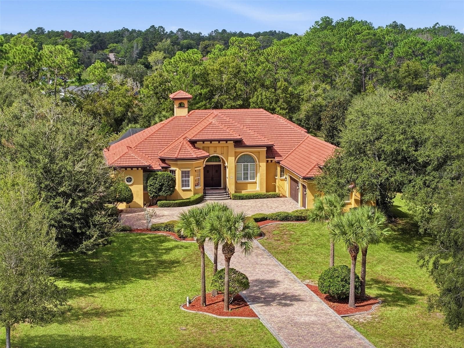 Incredible roofline with all the peaks and the bell tower accent! Incredible details everywhere! - 9313 HERNANDO RIDGE RD, WEEKI WACHEE