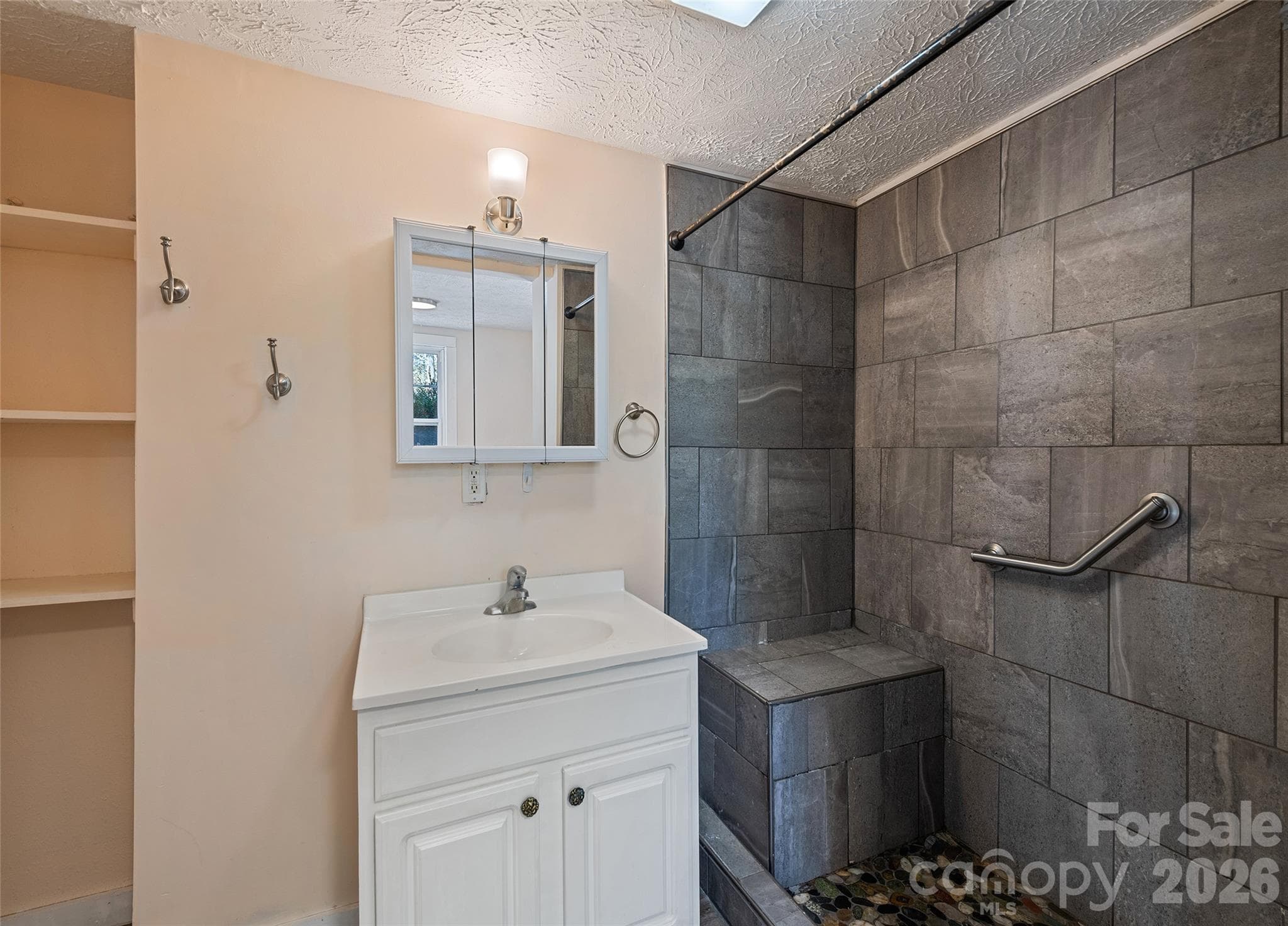 Primary Bath with Tiled Shower - 179 Jonathan Creek Road, Waynesville