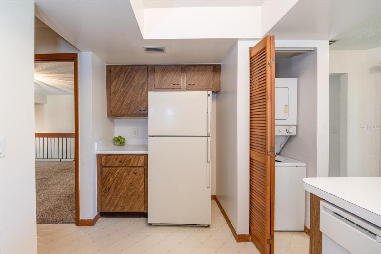 Laundry Closet In he Kitchen. Stackable Unit Conveys - 12 FAIRWAYS CIR #12, PALM COAST