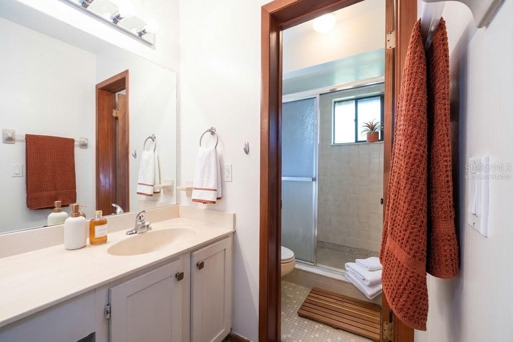 VIRTUALLY STAGED: ENSUITE WITH WALK IN SHOWER - 12 FAIRWAYS CIR #12, PALM COAST