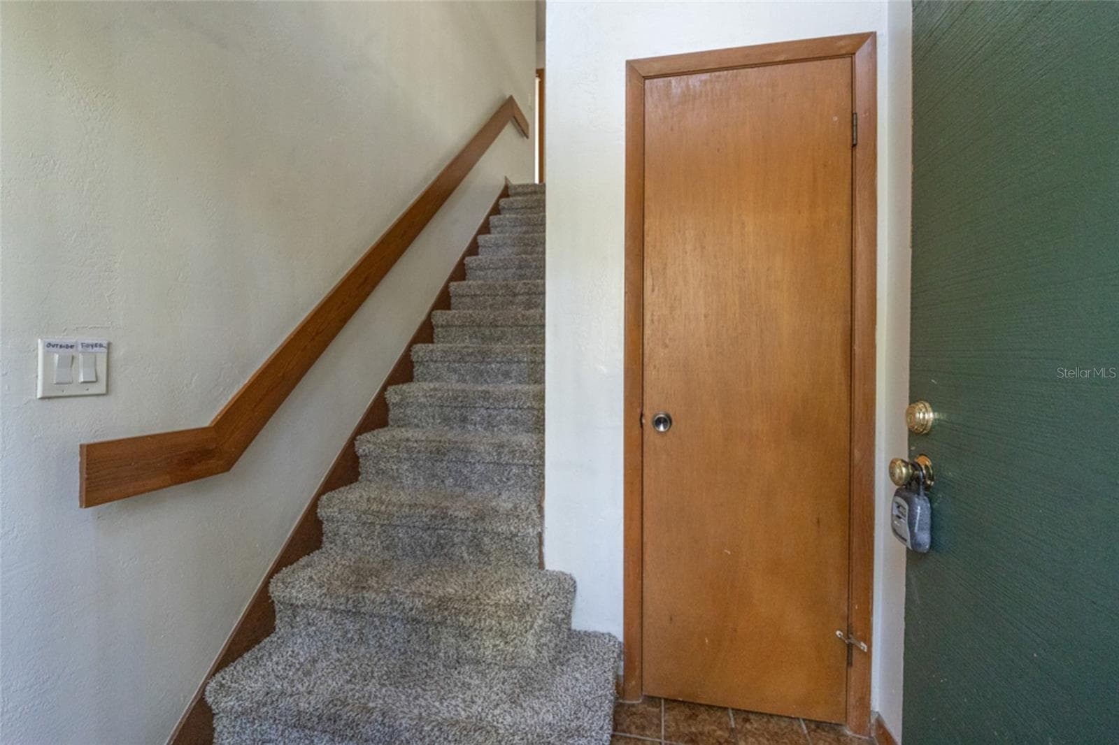 Entry On The First Floor Boasts Roomy Closet And Carpeted Stairs To Main Living Area - 12 FAIRWAYS CIR #12, PALM COAST
