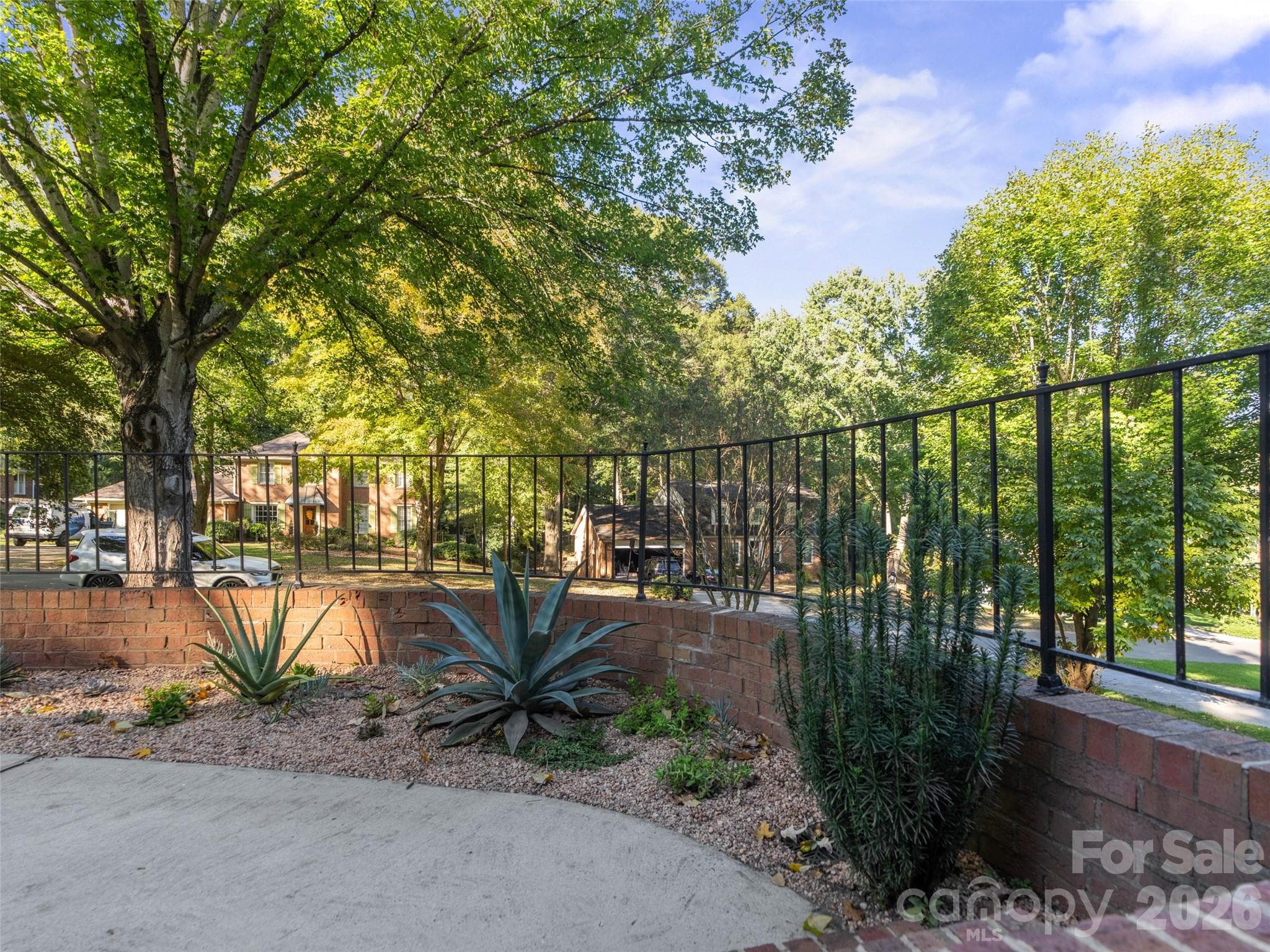 Beautifully landscaped sidewalk off of the front porch - 6626 Rocky Falls Road, Charlotte