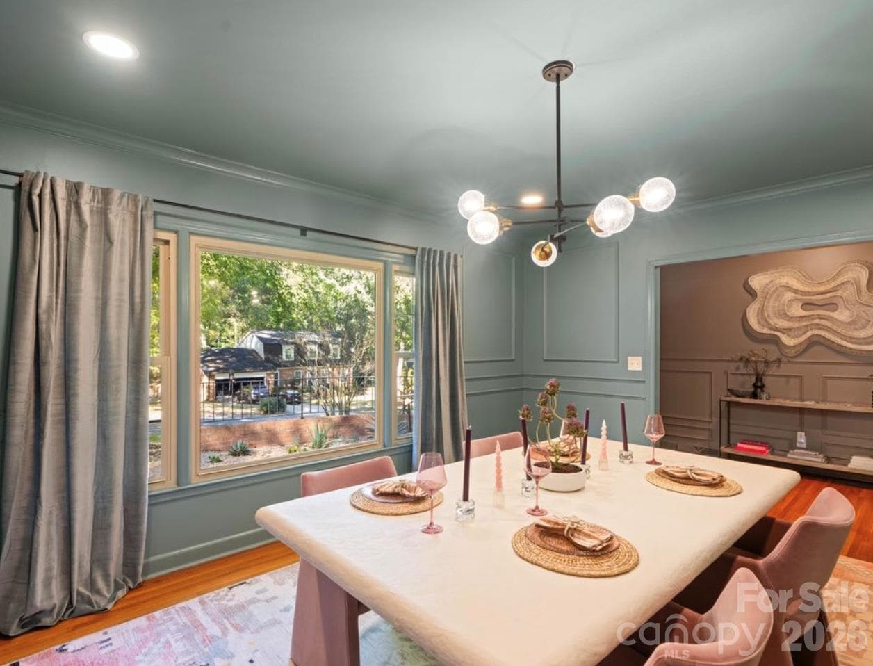 This luxurious dining suite just off the foyer welcomes guest, family and friends.  Natural light engulfs this room thru the large picture window. - 6626 Rocky Falls Road, Charlotte