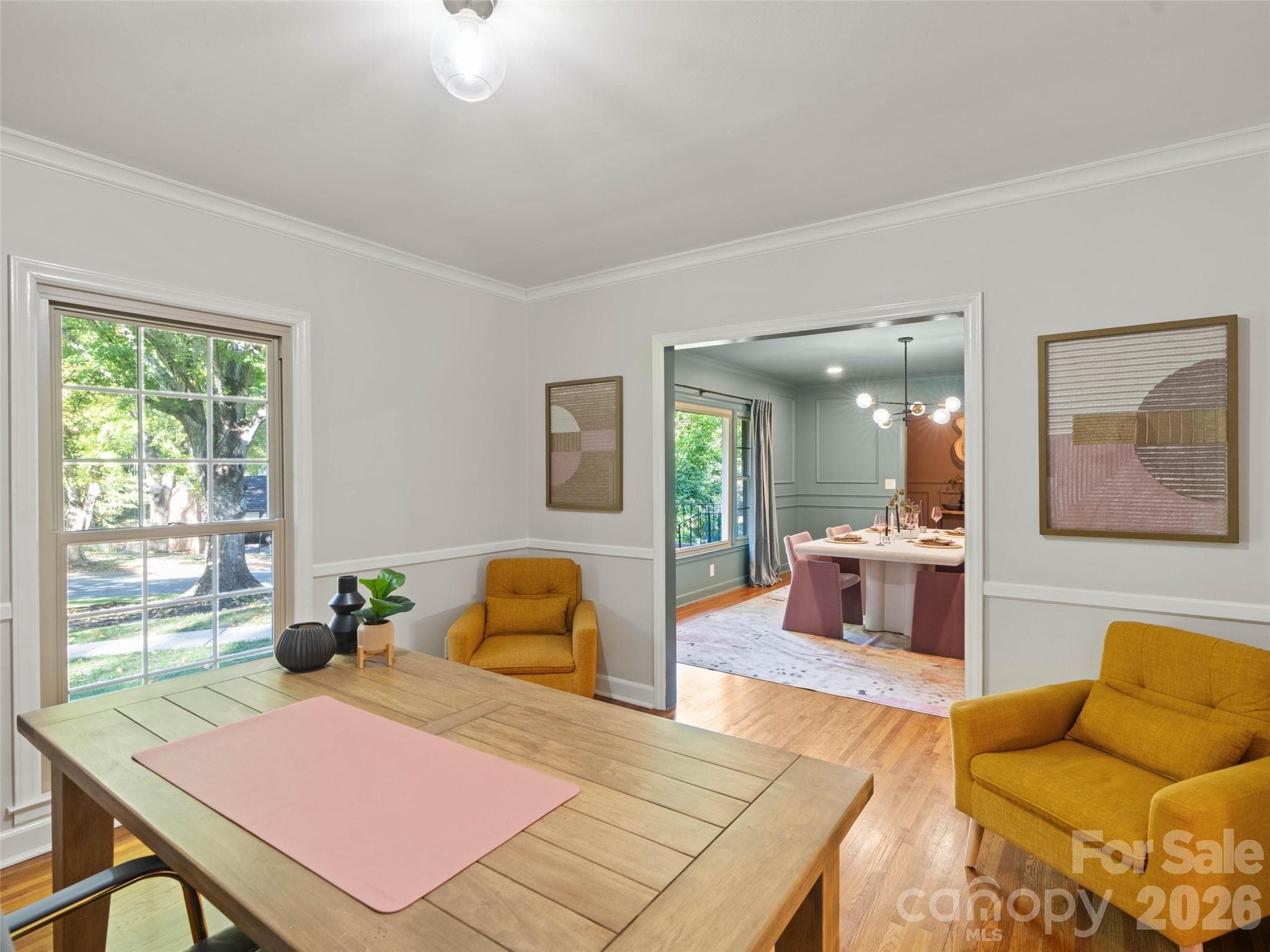 Traditionally used as a dining room, this versatile space has been thoughtfully transformed into a home office, offering a comfortable and functional setting for working from home, managing daily tasks, or creating a dedicated workspace. - 6626 Rocky Falls Road, Charlotte