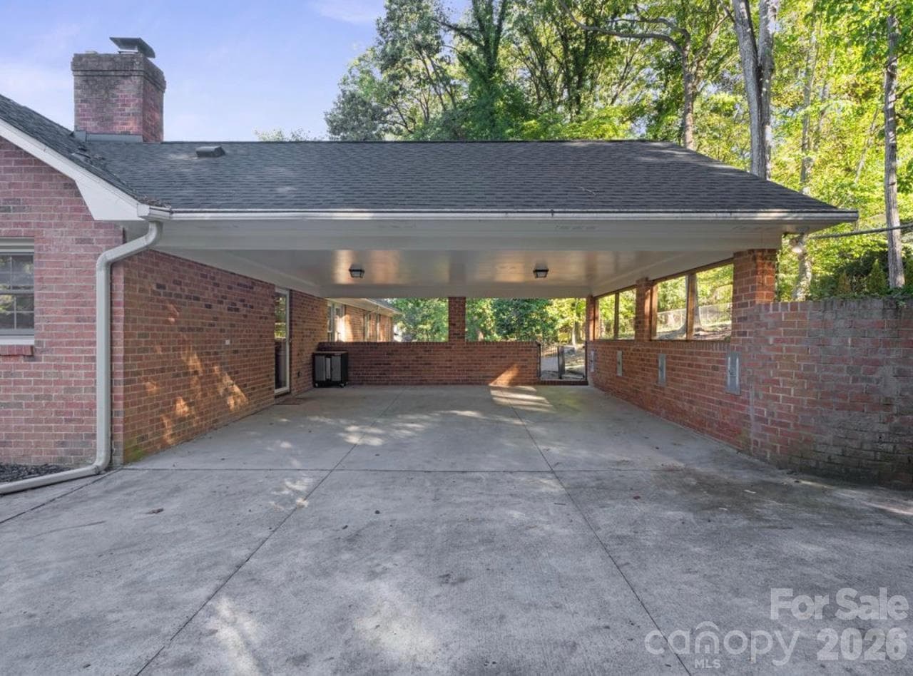 2 car covered carport located in the rear of the house attached to the main level - 6626 Rocky Falls Road, Charlotte