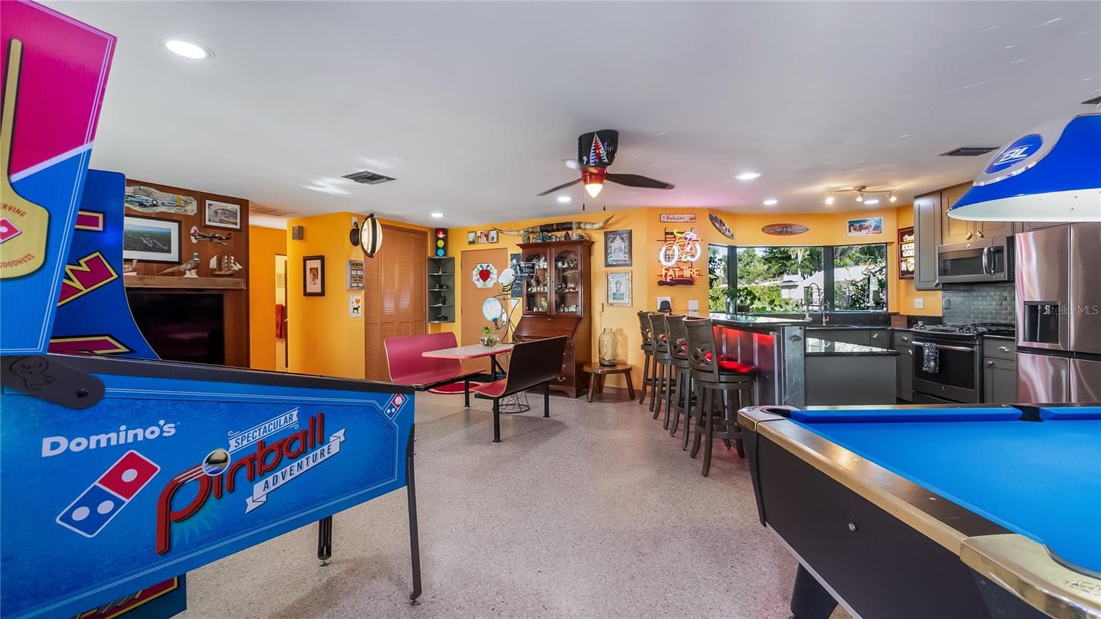 Main Home - Great room/kitchen/living room combo: Living room used as gathering space for game room fun. Two Sliders go out to covered back porch and screened in pool - 1730 NITA PL, CLERMONT