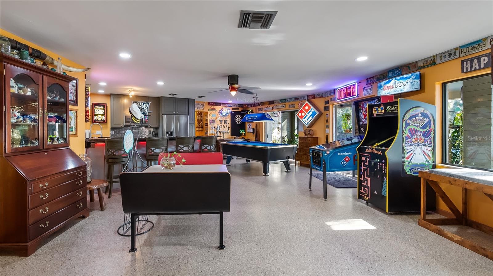 Main Home - Great room/kitchen/living room combo: Living room used as gathering space for game room fun. Two Sliders go out to covered back porch and screened in pool - 1730 NITA PL, CLERMONT