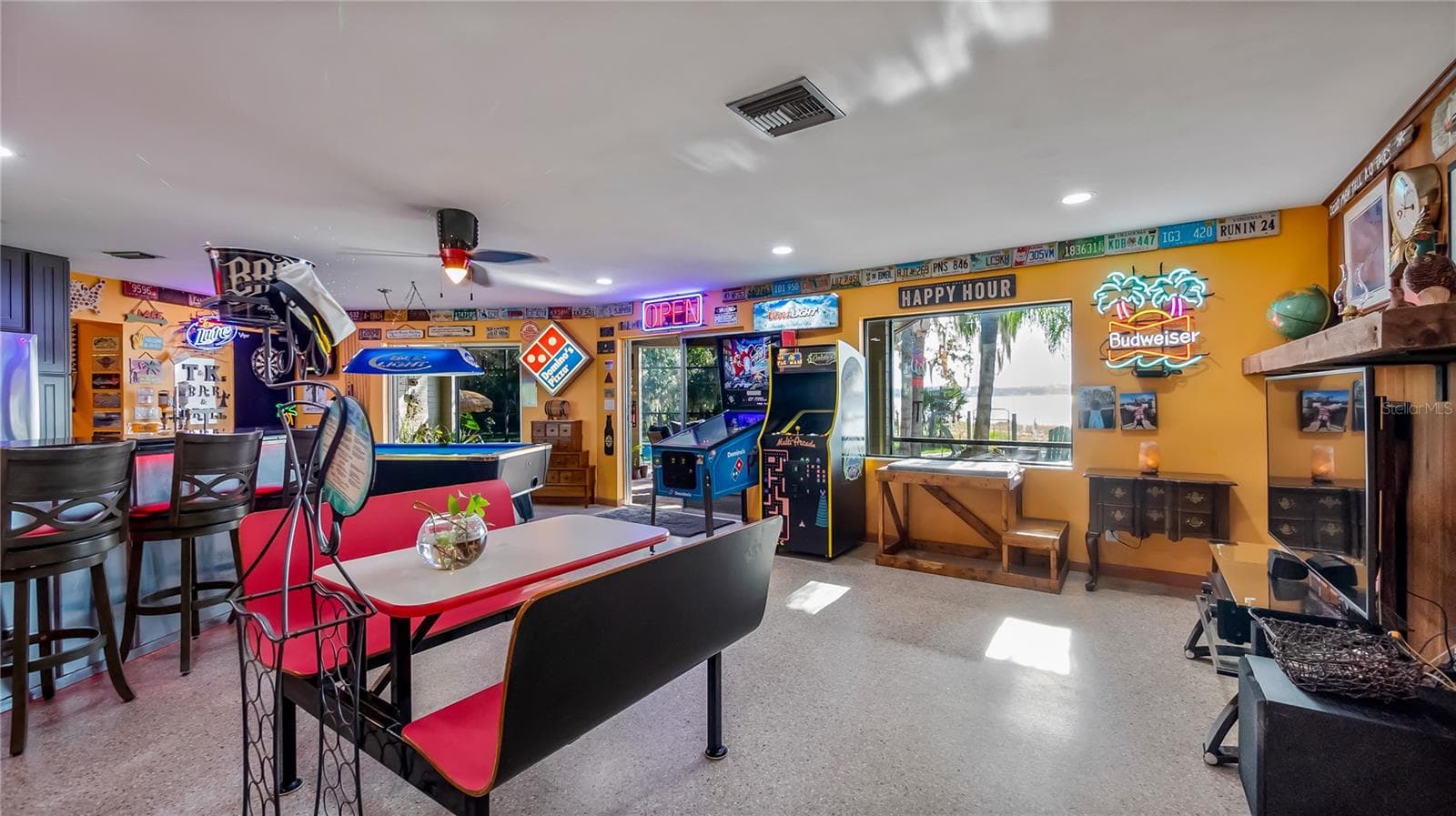 Main Home - Great room/kitchen/living room combo: Living room used as gathering space for game room fun. Two Sliders go out to covered back porch and screened in pool - 1730 NITA PL, CLERMONT