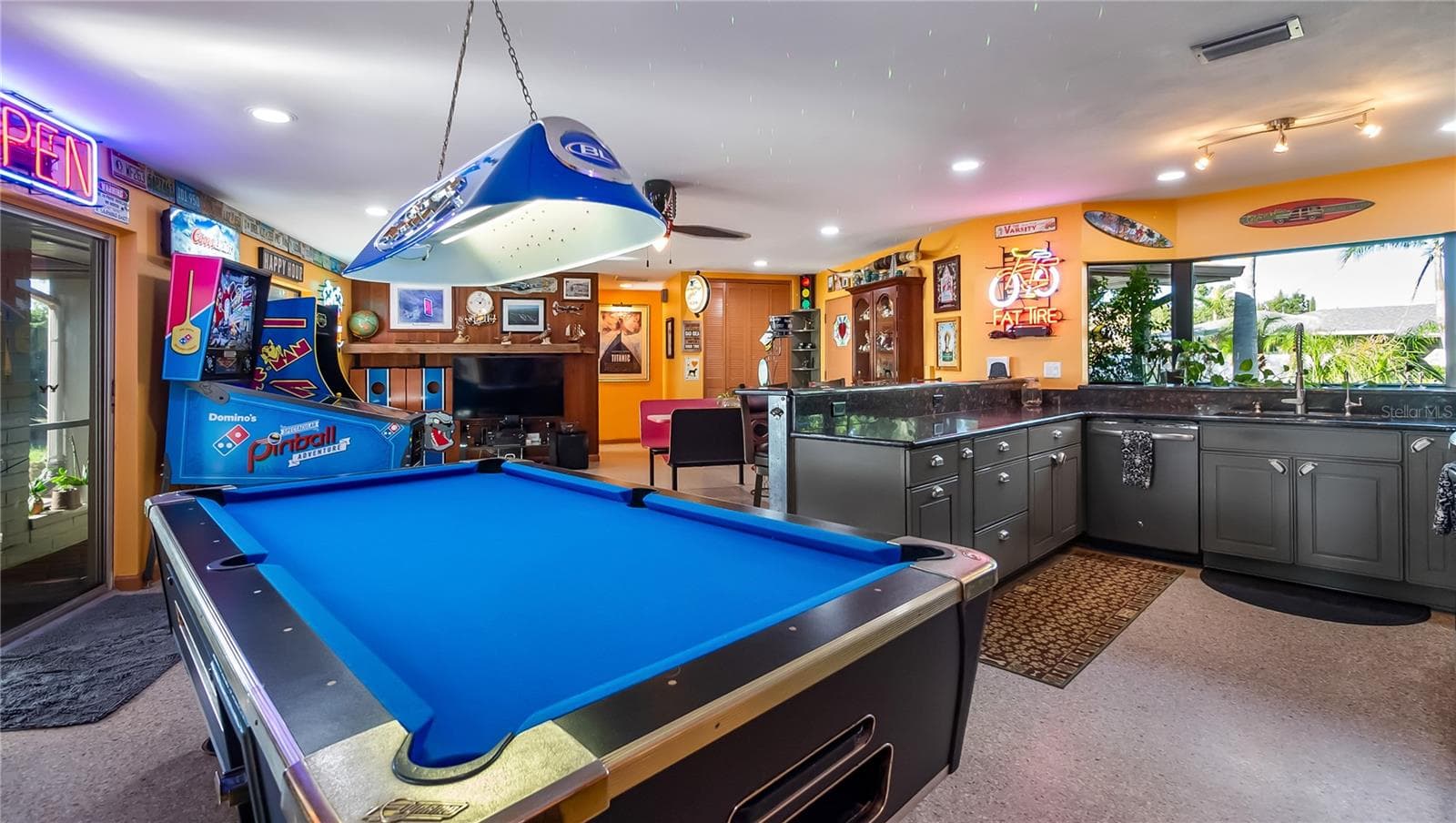 Main Home - Great room/kitchen/living room combo: Living room used as gathering space for game room fun. Two Sliders go out to covered back porch and screened in pool - 1730 NITA PL, CLERMONT