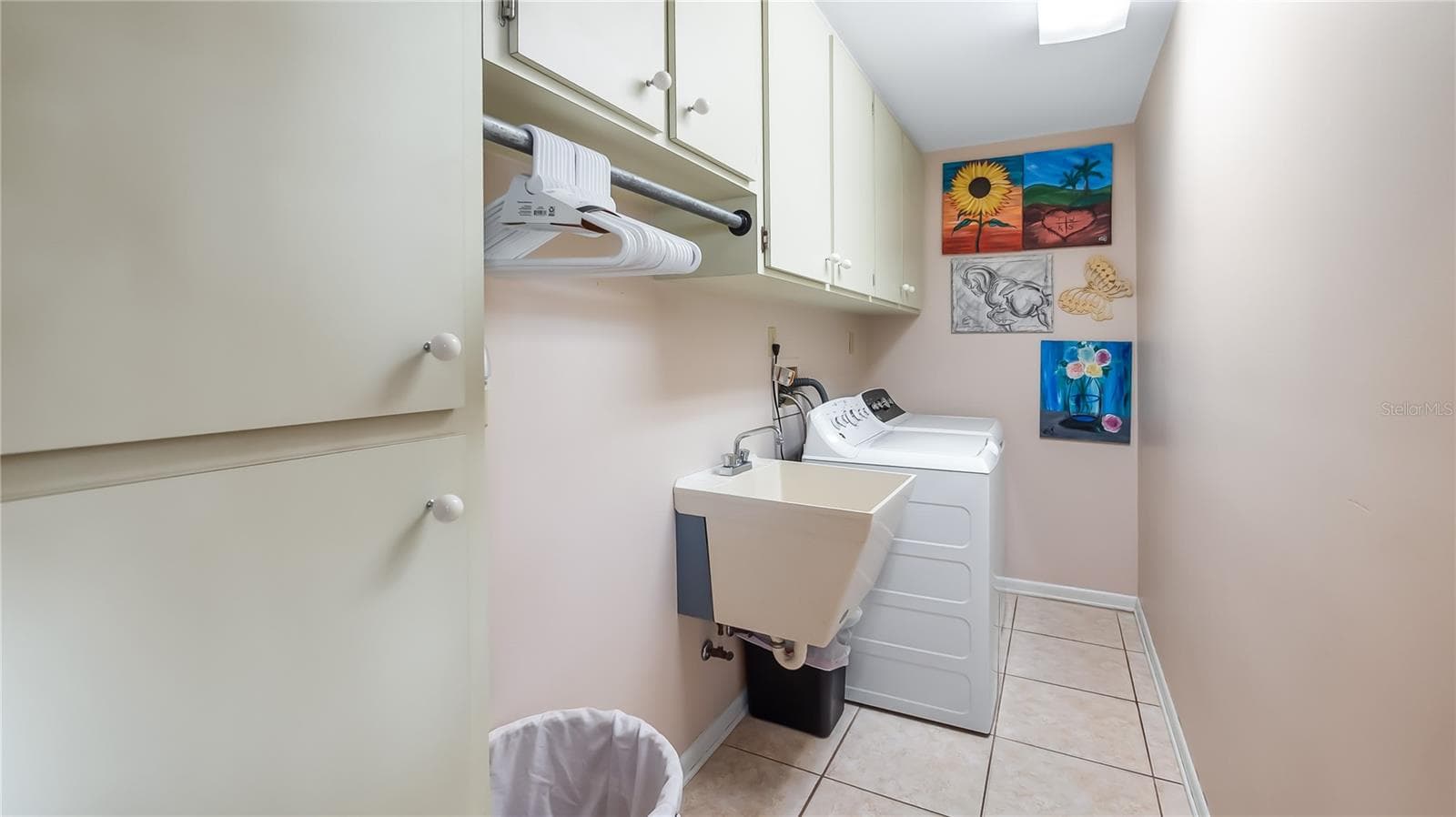 Laundry room located on north side of main home. Next to exit door to backyard/pool - 1730 NITA PL, CLERMONT