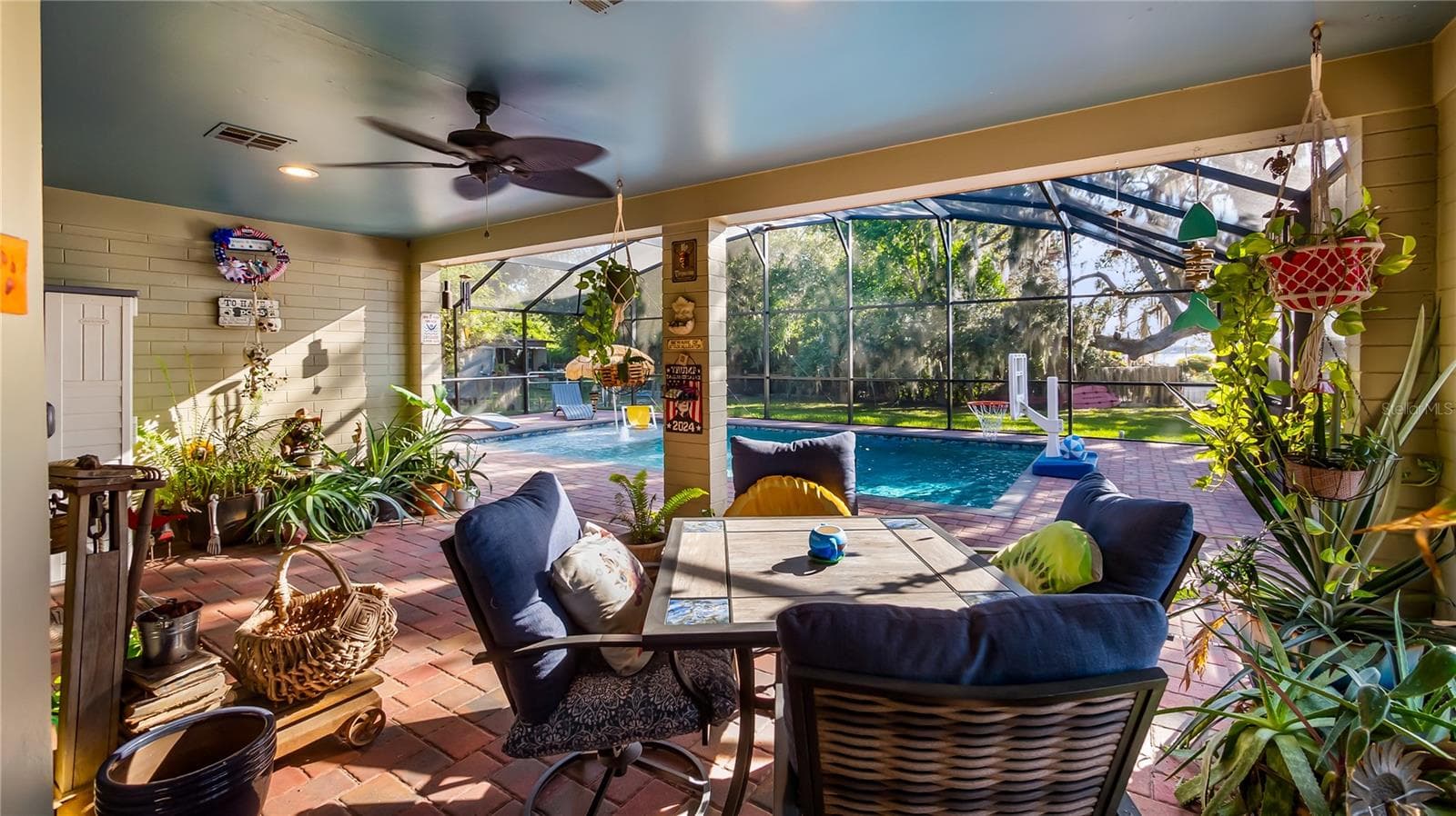 2 sets of sliders from great room to rear covered porch/pool added in 2023 - 1730 NITA PL, CLERMONT