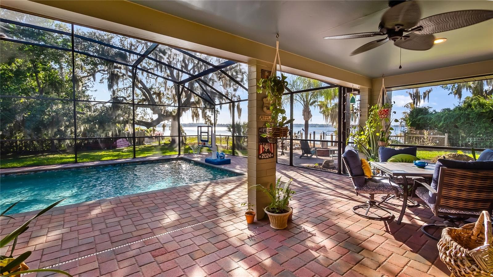 2 sets of sliders from great room to rear covered porch/pool added in 2023 - 1730 NITA PL, CLERMONT