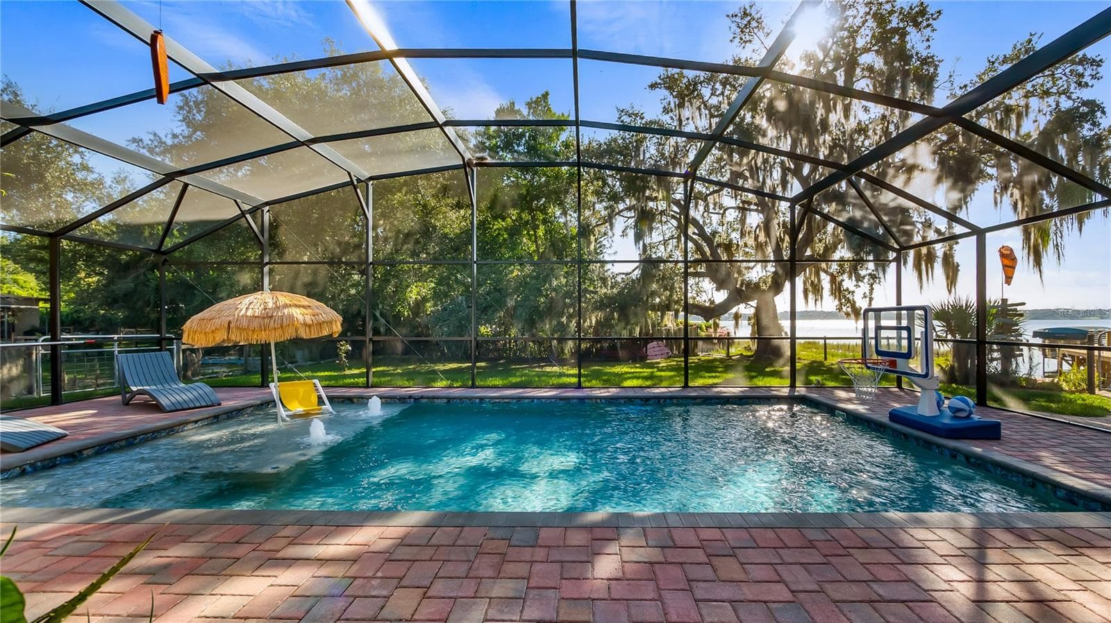2 sets of sliders from great room to rear covered porch/pool added in 2023 - 1730 NITA PL, CLERMONT