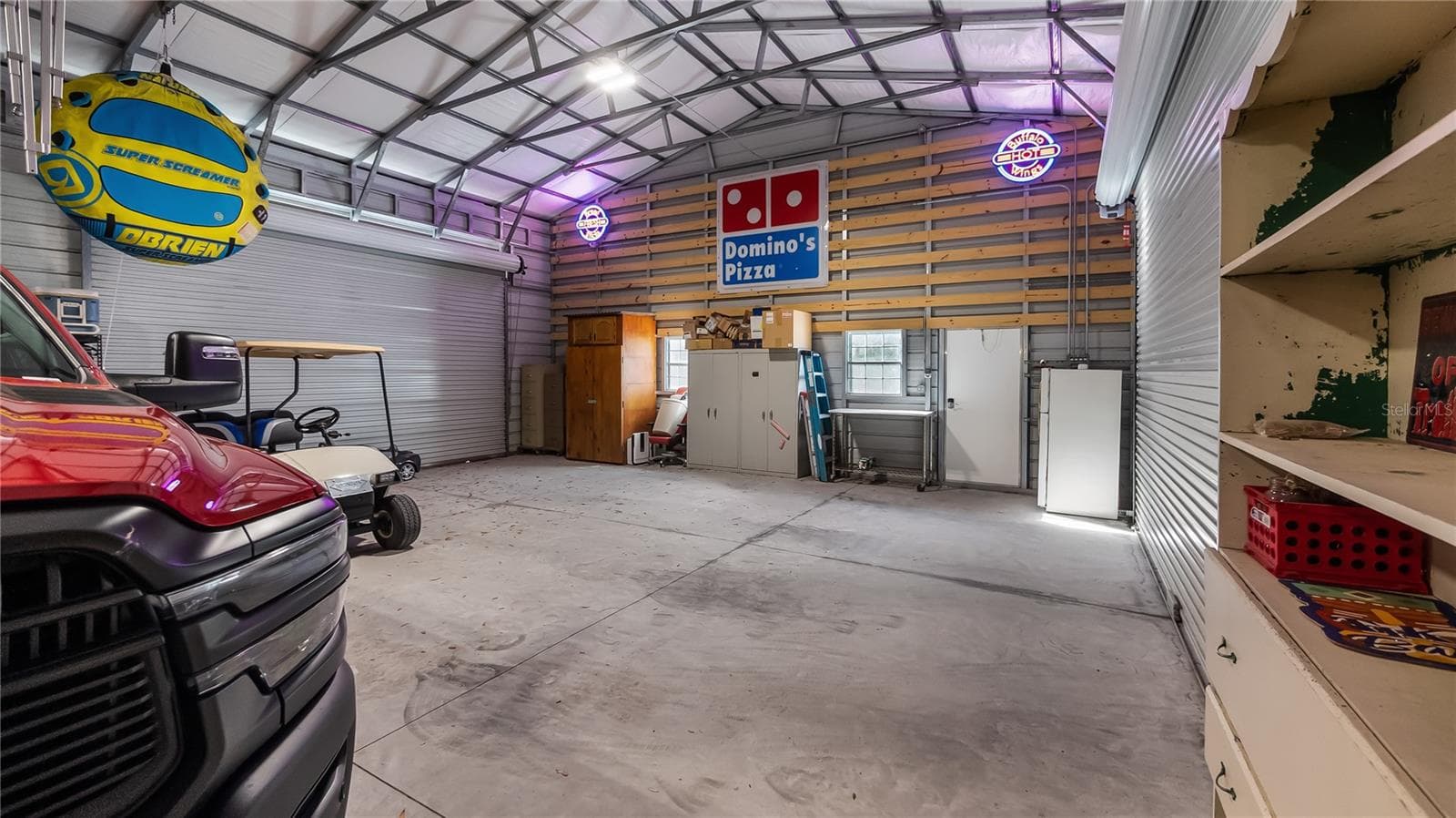 HUGE 30X75 Metal Building installed in October of 2022, has 6 large bay doors, some have electric openers - 1730 NITA PL, CLERMONT