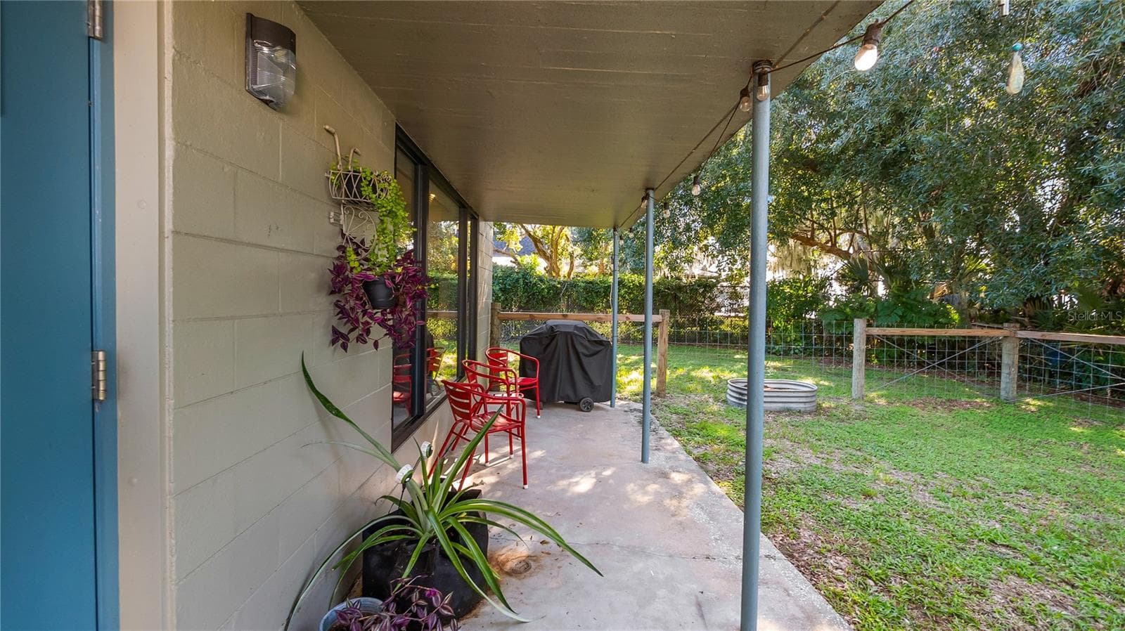 Detached garage and apartment. 2 car parking plus storage. Driveway off Lakeshore drive, little fenced in back yard. Full kitchen, laundry closet. remodeled. Pre wired for generator plug access so it can be run on a generator. - 1730 NITA PL, CLERMONT
