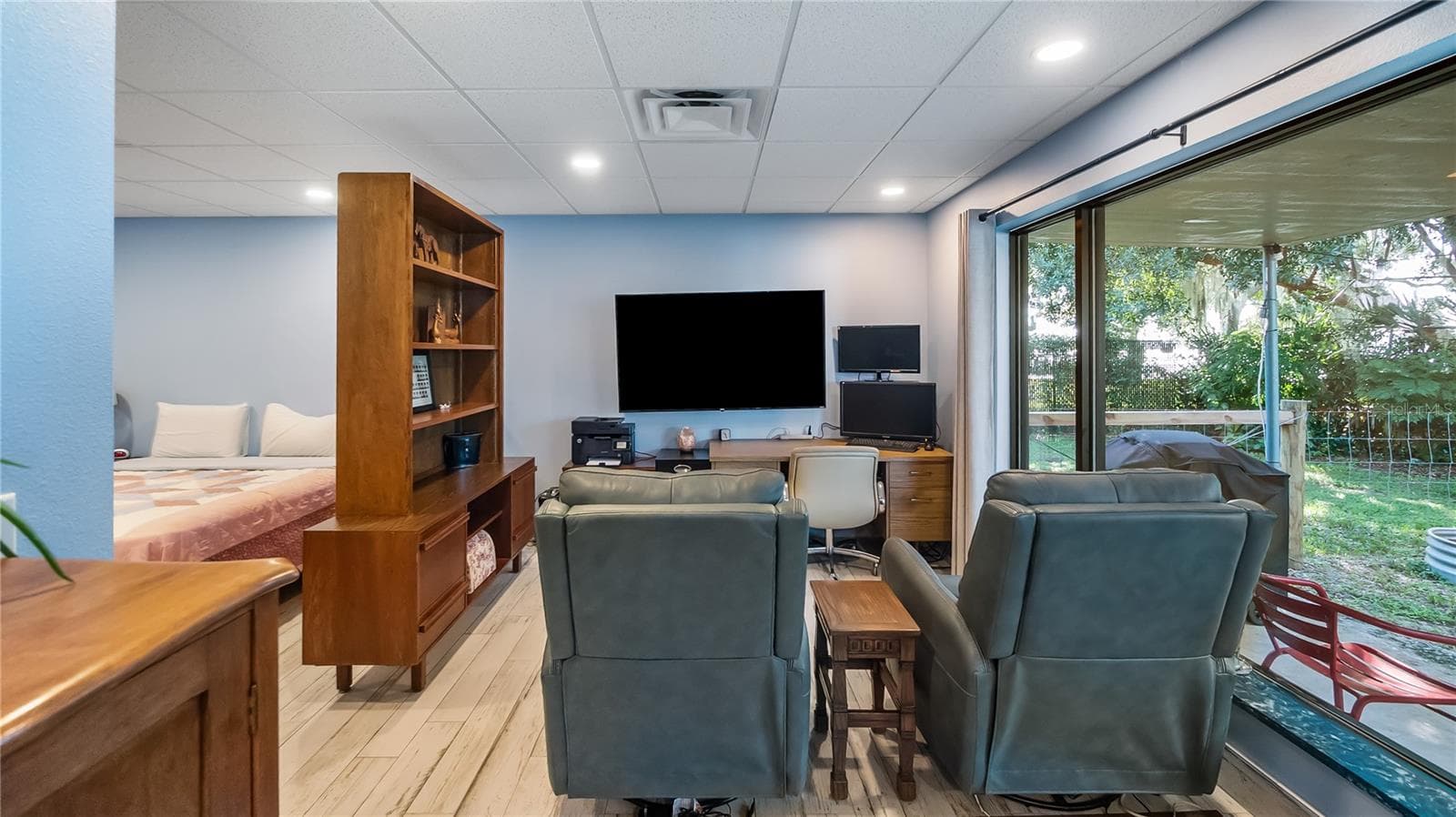 Detached garage and apartment. 2 car parking plus storage. Driveway off Lakeshore drive, little fenced in back yard. Full kitchen, laundry closet. remodeled. Pre wired for generator plug access so it can be run on a generator. - 1730 NITA PL, CLERMONT