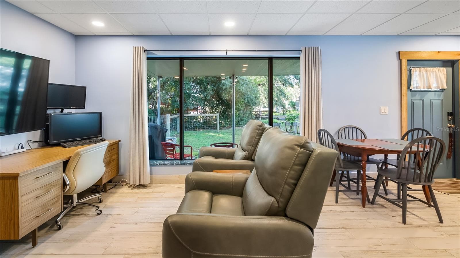 Detached garage and apartment. 2 car parking plus storage. Driveway off Lakeshore drive, little fenced in back yard. Full kitchen, laundry closet. remodeled. Pre wired for generator plug access so it can be run on a generator. - 1730 NITA PL, CLERMONT