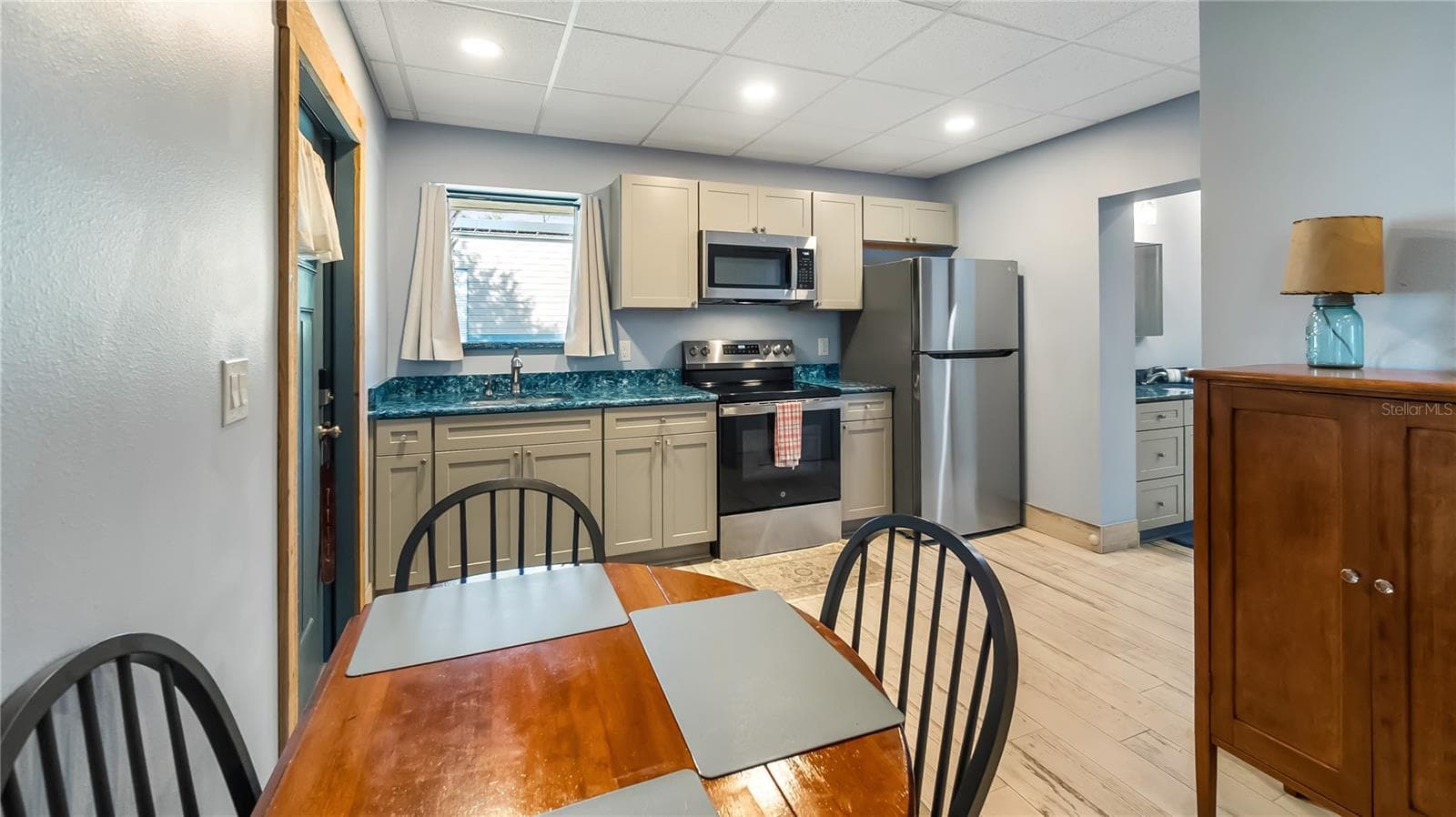 Detached garage and apartment. 2 car parking plus storage. Driveway off Lakeshore drive, little fenced in back yard. Full kitchen, laundry closet. remodeled. Pre wired for generator plug access so it can be run on a generator. - 1730 NITA PL, CLERMONT