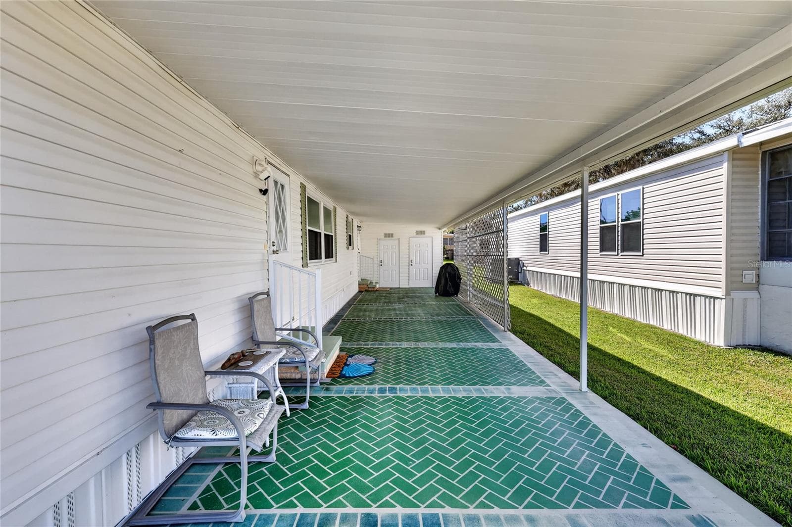 Carport/entrance to Home - 565 TAMMI DR, LEESBURG