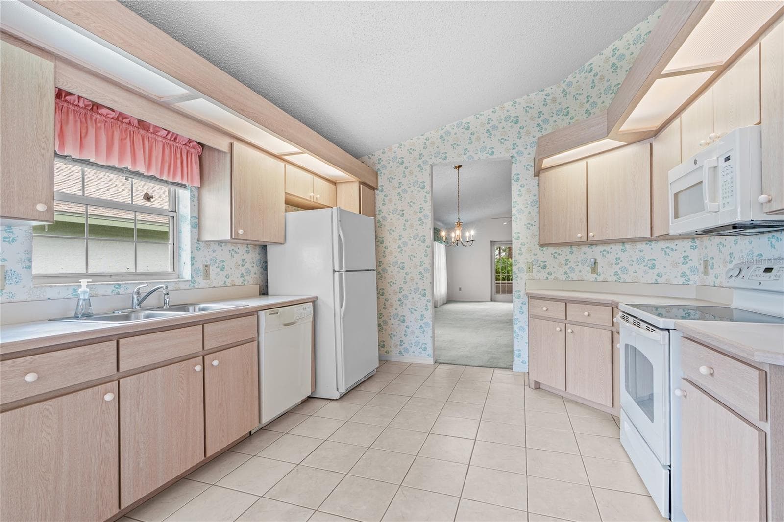 Plenty of Cabinet Space in Kitchen - 245 GLENBRIAR CIR, DAYTONA BEACH