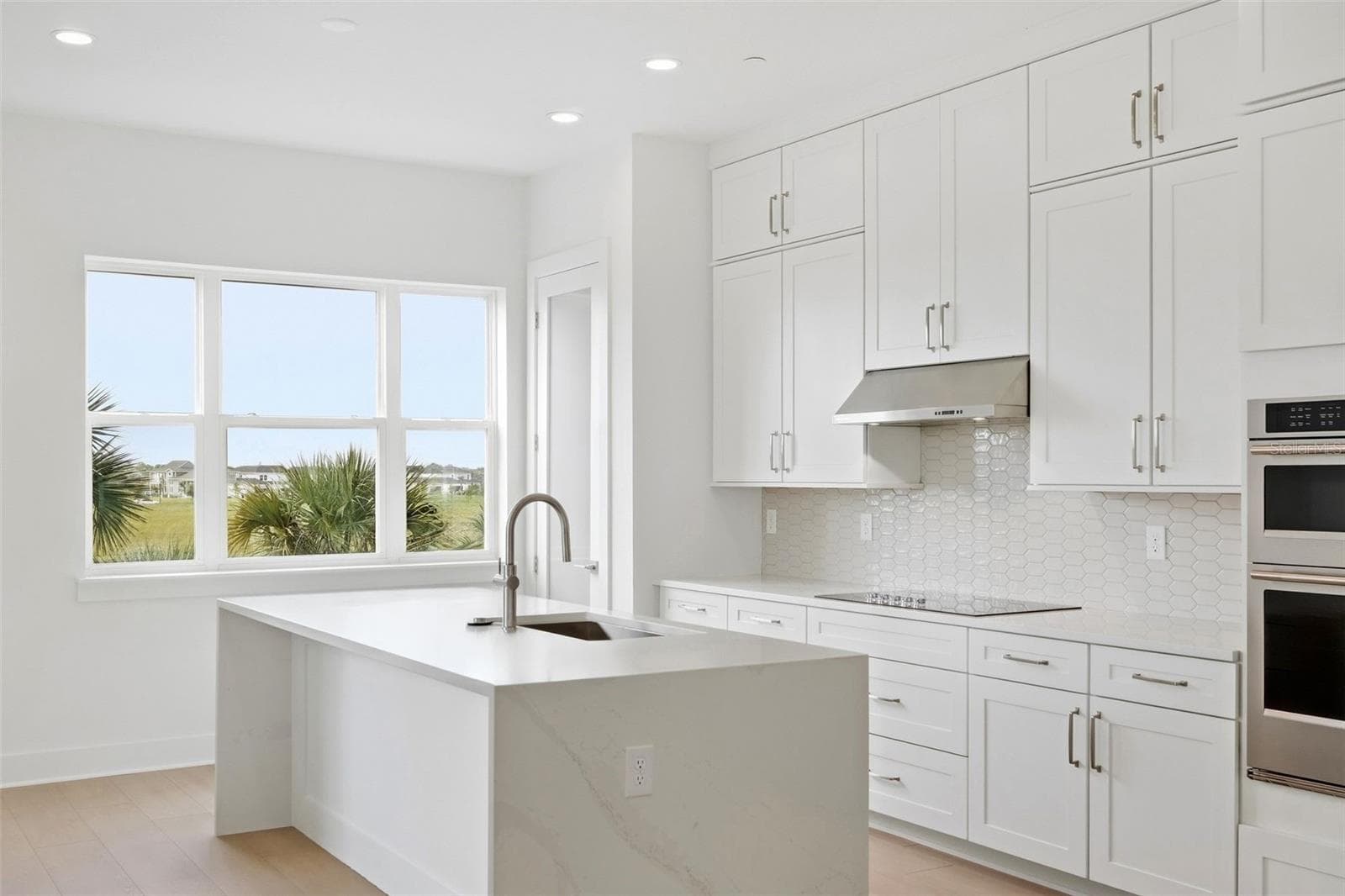 Waterfall island in kitchen - 9317 LUMINARY BLVD, ORLANDO