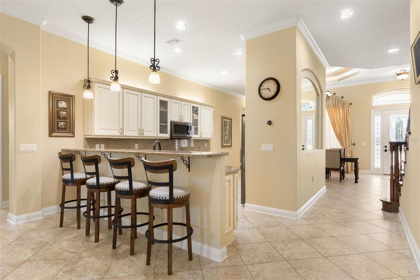 An inviting connection between the kitchen and gathering room creates a welcoming setting for conversation, entertaining and everyday living. - 25 EMERALD LAKE CT, PALM COAST