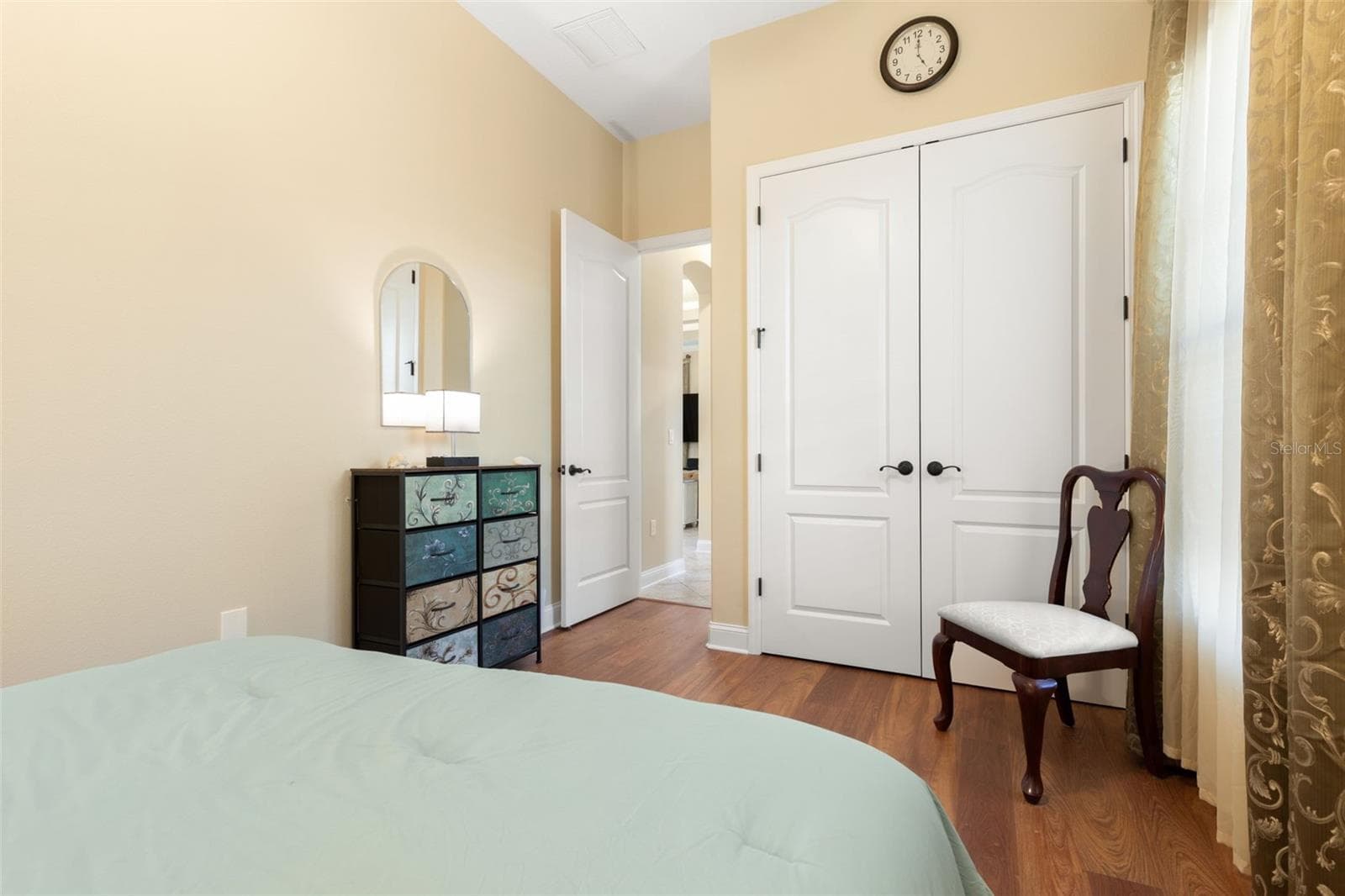 Another perspective of First-Floor Bedroom #2, highlighting its closet space and convenient location within the home. - 25 EMERALD LAKE CT, PALM COAST
