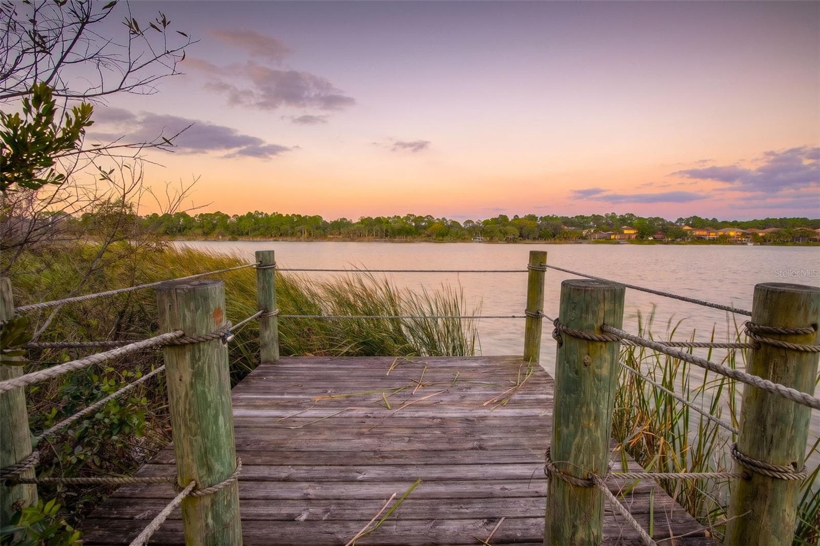 Your private escape on Emerald Lake, where peaceful sunsets and tranquil water views create the perfect place to unwind. - 25 EMERALD LAKE CT, PALM COAST