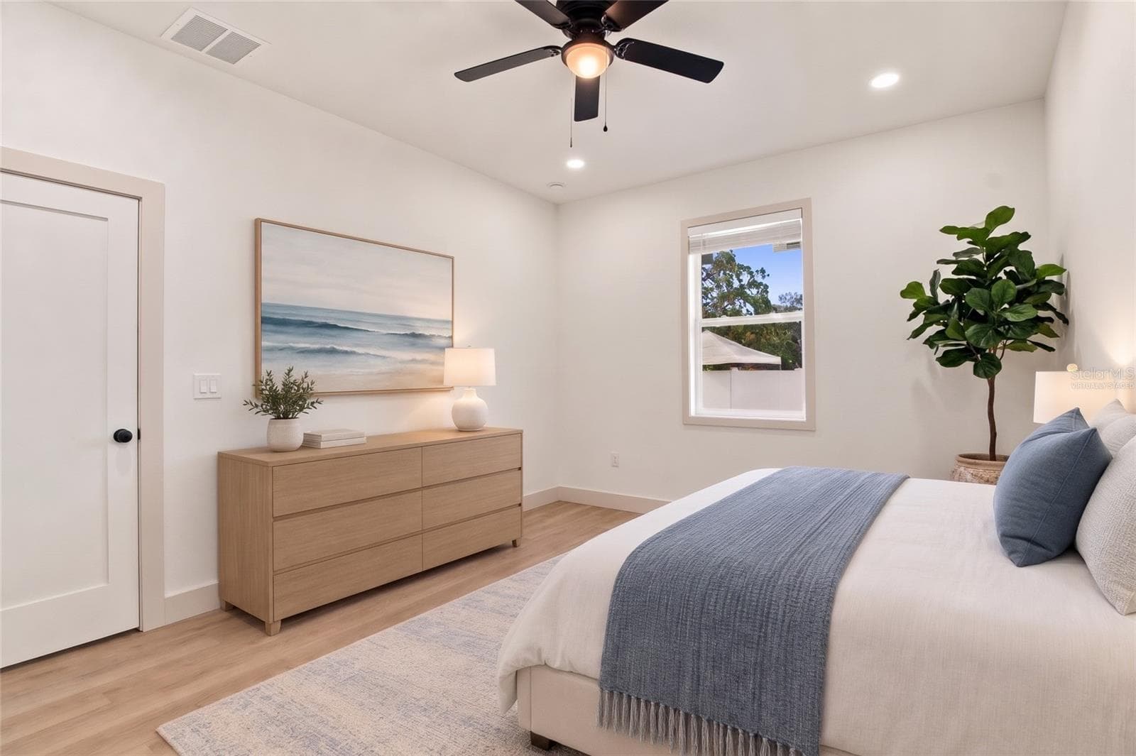 virtually staged primary bedroom - 8514 N 12TH ST, TAMPA
